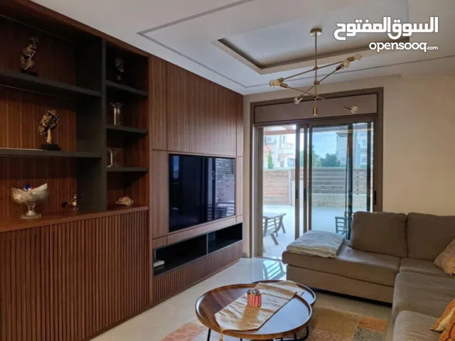 شقه للبيع طابق ارضي مع حديقه في المصيون خلف البنك العربي