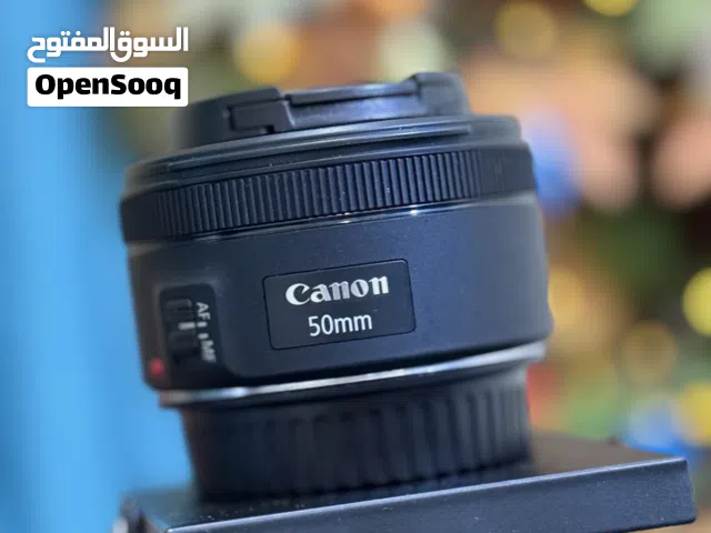 Lens and device