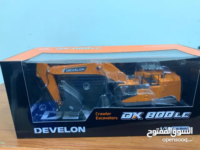 Brand new, un-used Develon Crawler Excavator 1/50 Scale Die-Cast Metal Model and other accessories