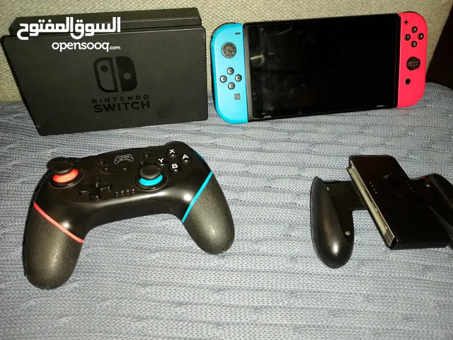 Nintendo switch with 2 controller and there is a thing to connect it to the tv