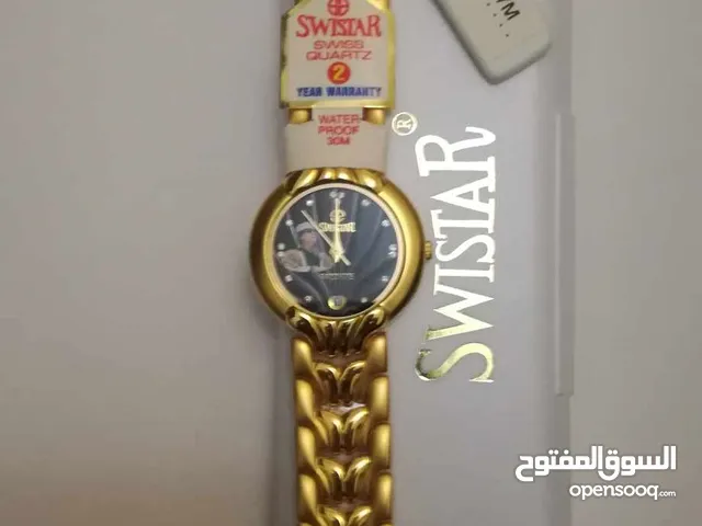 ساعة يد رجالية مطلية ذهب نوع سويستار عليها صورة الزعيم معمر القذافي