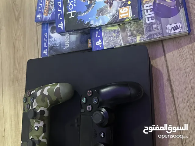 PlayStation 4 with 2 controllers and 5 games