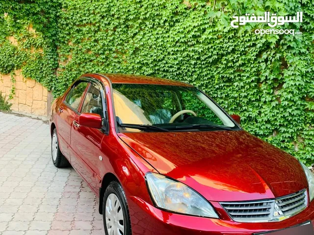 ميتسوبيشي لانسر 2009 بحالة الشركه 1600cc لون خمري للبيع