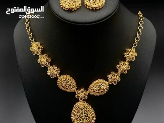 طقم مطلي ذهب عيار 21