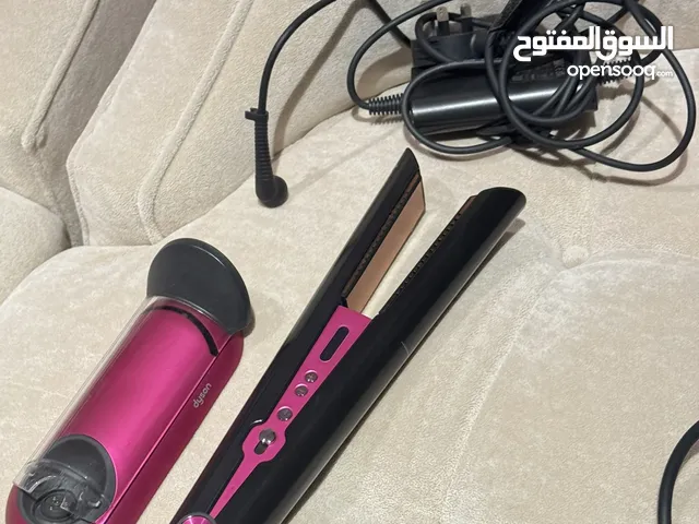 Dyson hair straightener with charger  in excellent condition and easy to use
