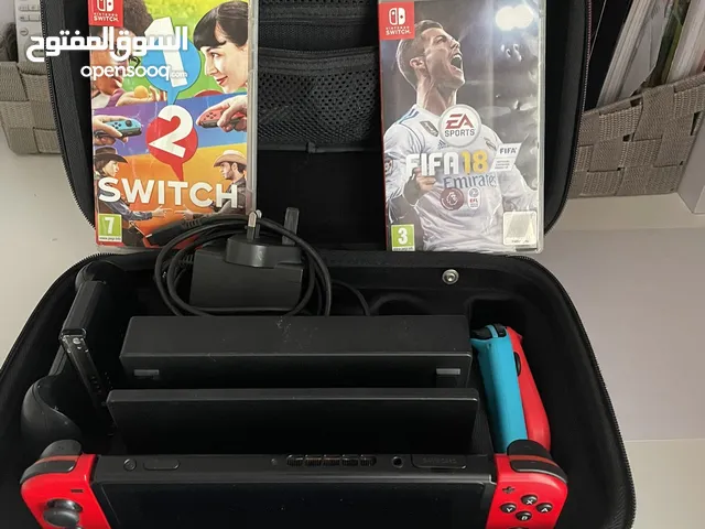 Nintendo switch for sale with extra controllers and 2 games