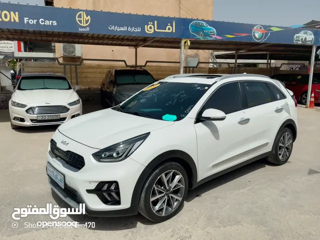 كيا نيرو هايبرد تورنغ 2022 فل كامل مع فتحه 7جيد من المستورد مباشره بحاله الوكاله بسعر مناسب