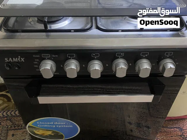 غاز 4 عيون سامكس مع فرن وشواية ونظام أمان  وشعلة كهربائية لون اسود