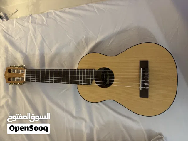 قيتار صغير الحجم ينفع للرجال و ألأطفال الصغار