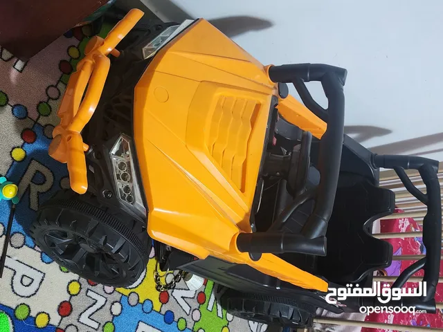 سيارة اطفال شحن حجم كبير تصلح لجميع الاعمار لون اورنج ممتازه