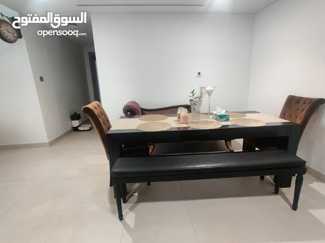 Dining table (The ONE), benches, chairs (Marina) for AED 800.
