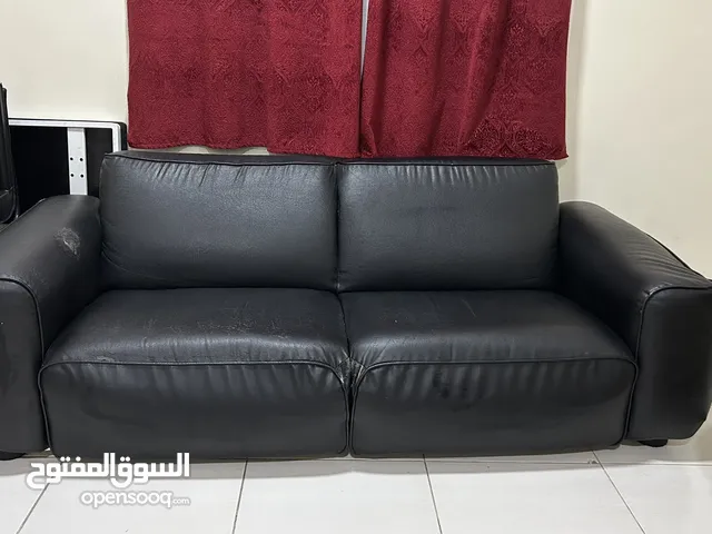Black four seater sofa