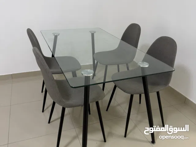 Modern Glass Top Dining Table with Stylish Chairs