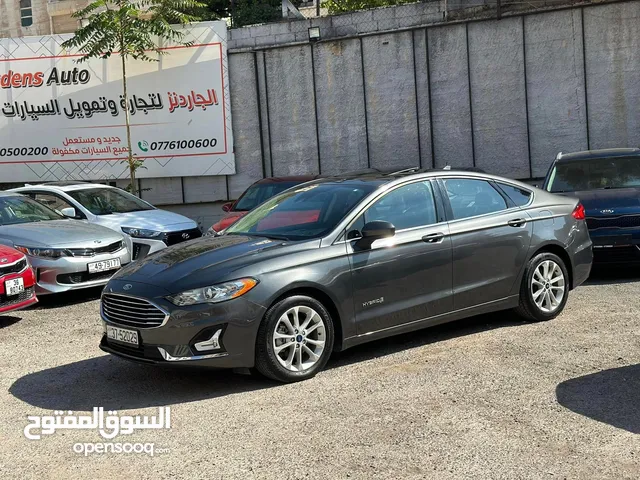 فورد فيوجن 2019 صنف SE مع فتحة فحص كامل جمرك جديد مكفوله سنتين بحالة الشركه