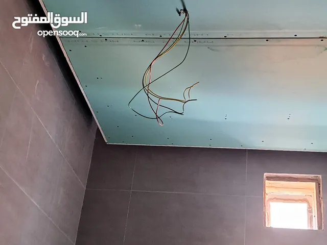 Gypsum board worker