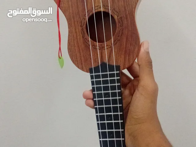قيتار يوكوليلي للاطفال، يمكن ان نغير الصوت من خلال النقاط التي في الخلف، ukulele guitar