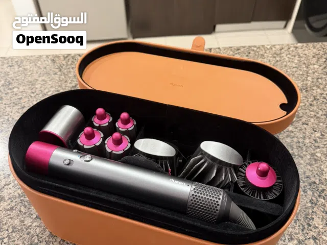 Dyson air wrap ( grey and pink )  used with care and regular cleaning perfect for daily styling