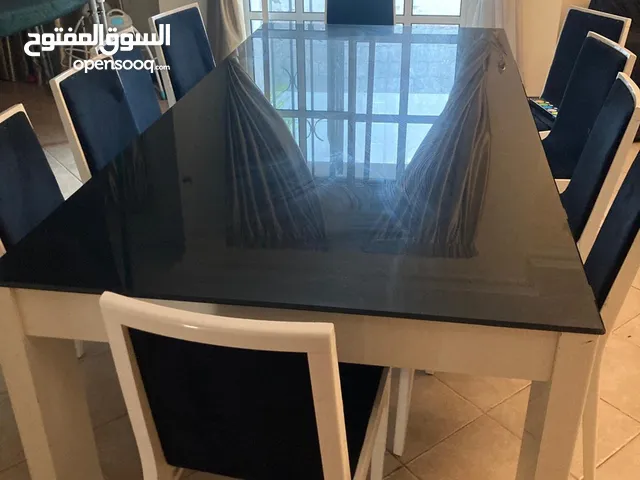 Glass table with 8 chairs plus (extra 2)