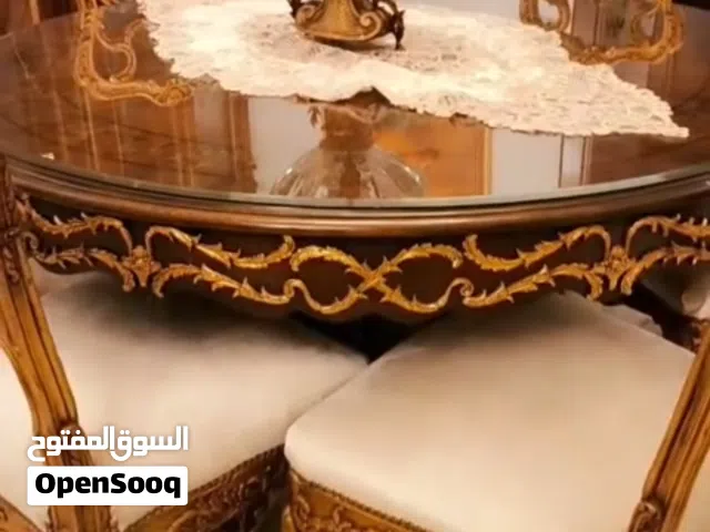 طقم كنب خشب دمياطي مع طاولة سفره وكراسيها..وبوفيه وطاولات وسط وجانبيه وثريات جانبيه عدد 2وثريات سقف