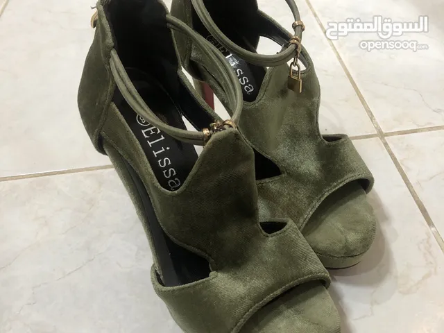 Green With Heels in Sharjah