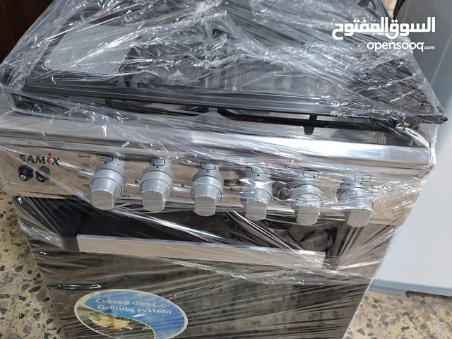 غاز 4عيون مع فرن فوق وتحت ستانليس مقاس 60س مع كهرباء بحالة الجديد