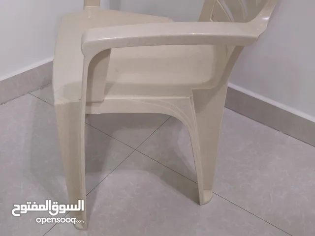 plastic chairs with arms. rate at 20 aed each