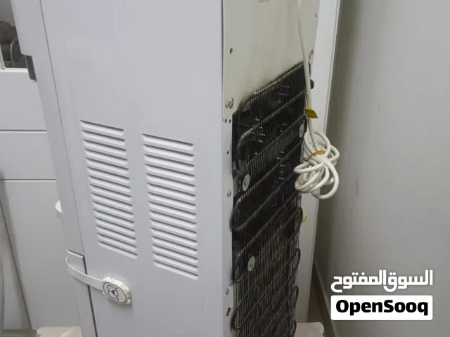 fridge,water cooler, vacuum cleaner,studio accessorizes and table for tailoring