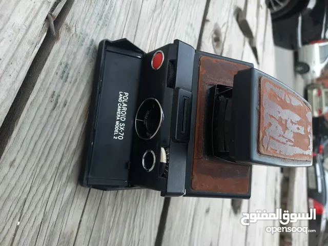 polarid sx70 & OLYMPUS & KODAK DISC