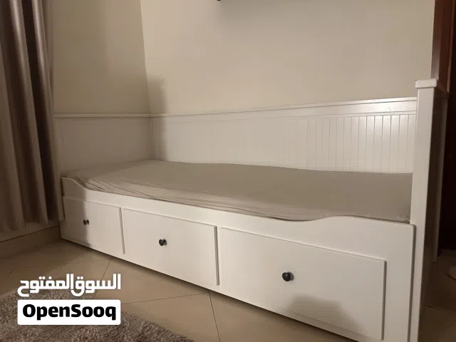 A daybed that could be used as a single bed and a double bed and a couch.