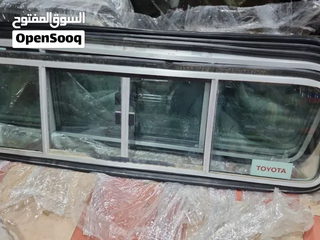 زجاج خلفي سحاب أصلي وكالة خاص بسيارة تويوتا لاندكروزر شاص موديل 2024، قطعة جديدة بالكامل وبحالة ممتا