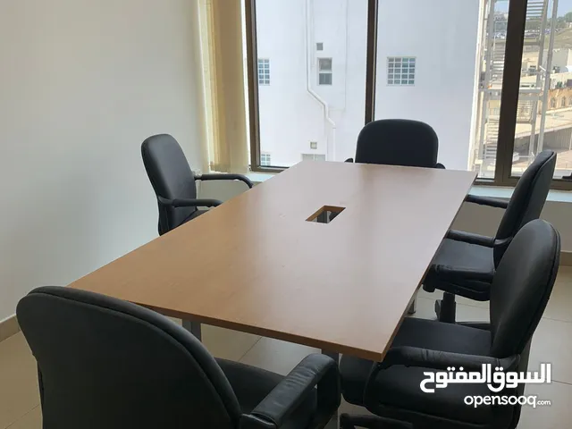 Meeting table with 7 chairs and 2 sofas