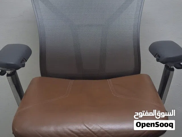 Allsteel Acuity task chair with a light brown seat and mesh back