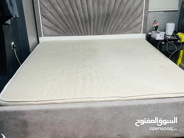 King size bed with mattress and cupboard