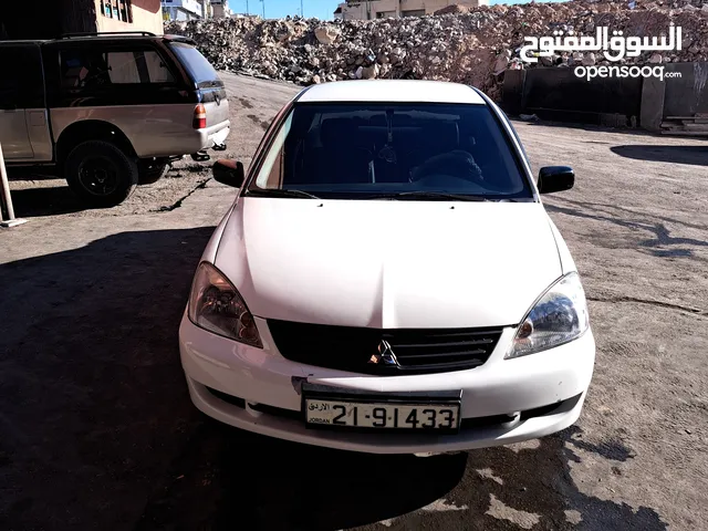 لانسر 2013 مش ناقصها شي محرك 1300 في حالة الوكاله