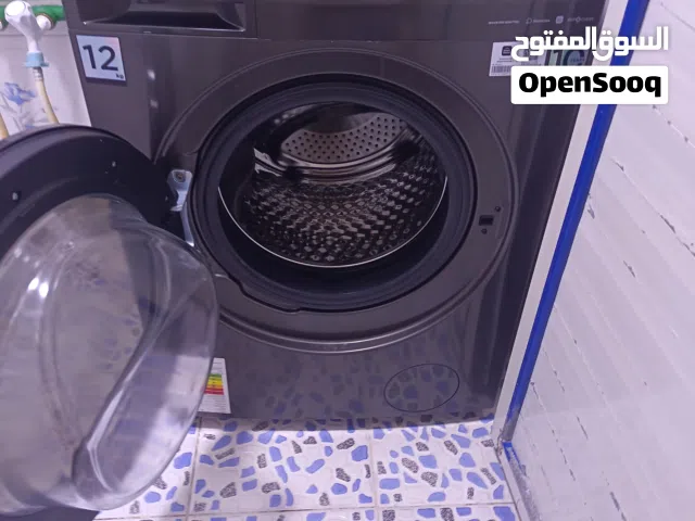 غسالة ملابس 12 كيلو فتحه اماميه مديا جديده استعمال اقل من 6اشهر