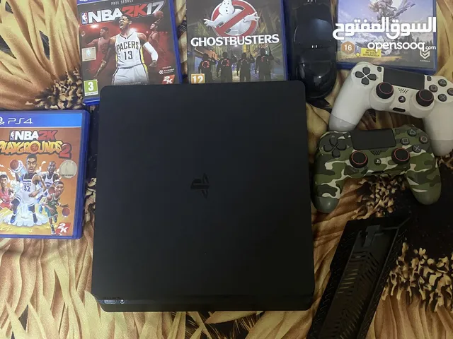 PS4 slim new with box and accessories and four gaming disc
