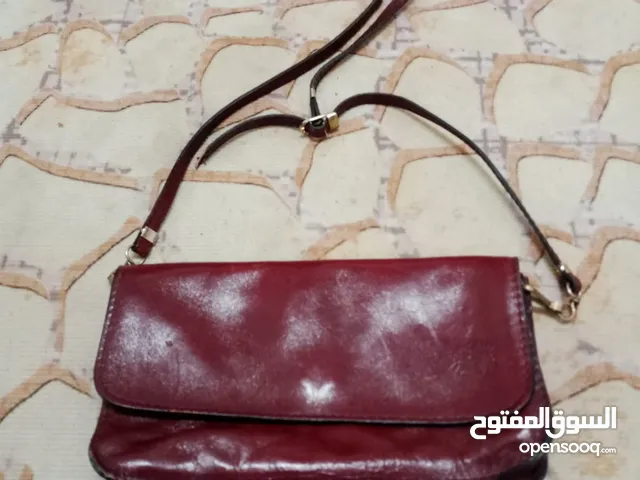شنطة وحقيبة جلدية فاخرة وانيقة للسيدات بلون خمري أنيق مصنوعة من الجلد الأصلي الطبيعي 100 %