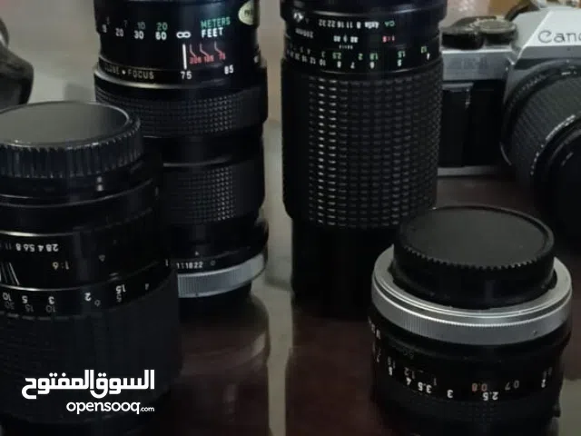 camera(Canon)with its lenses and tripod