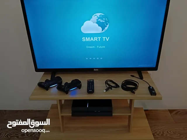 للبيع طقم يضم تلفاز + جهاز PlayStation 4 + ملحقات كاملة + طاولة خشبية