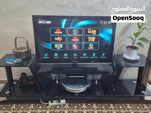 طاولة تلفزيون زجاج لون أسود