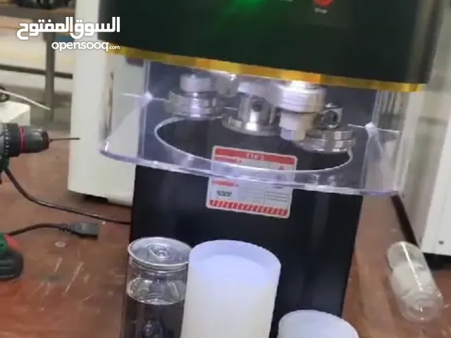 ماكنة اغلاق علب . مثال علب القهوة العصير