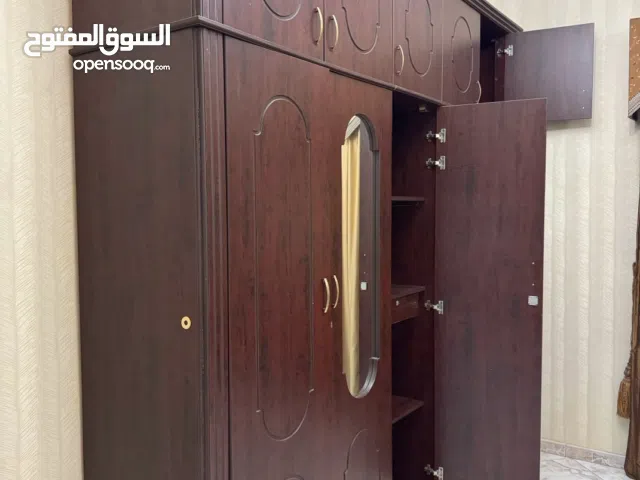 Elegant Dark Wood Wardrobe with Ample Storage