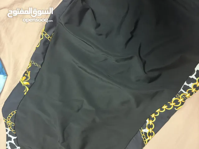 Black swimming suit jump