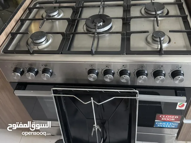 High-quality 5-burner gas stove with built-in oven and grill system. Perfect working condition