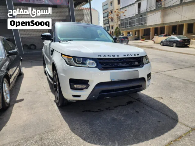 Range Rover Supercharged 2014 / 6 cylinders /white color, black top.