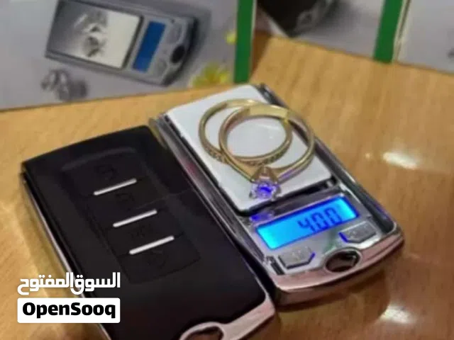 ميزان الكتروني صغير الحجم على شكل مفتاح سيارة مع بطارية