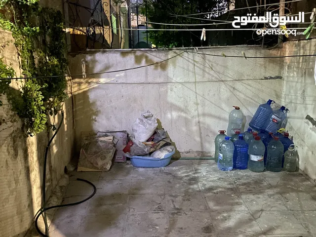 شقة ارضية للبيع بجبل الحسين ، شارع يافا ، عمارة 82 ، شقة 1 مع ترس وكراج سيارة