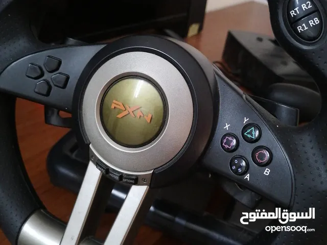 a pxn simulator pack with a steering wheel and a pedals with a gear shifter