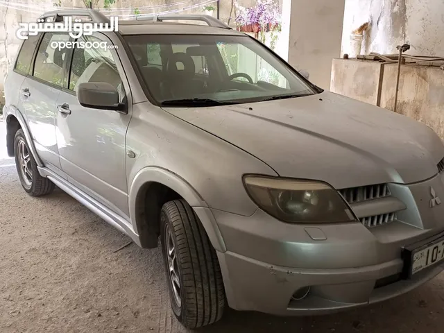 ميتسوبيشي آوتلاندر 2006 للبيع بحالة ممتازة موتور 2400 جير توبترونك دفع رباعي جلد فتحة وفتحة ثانية با