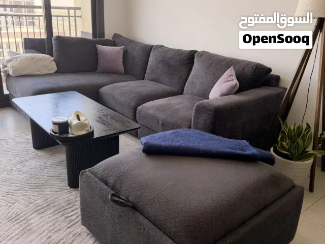 L-Shaped Sofa + Storage Ottoman + Coffee Table – AED 2,700